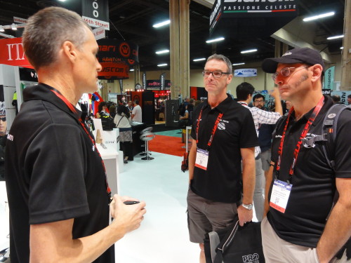 Jerry Gerlich discusses new products with Mark Dwyre and Scherrit Knoesen while at Interbike.